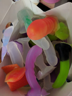 a bunch of tiny dildos in a box